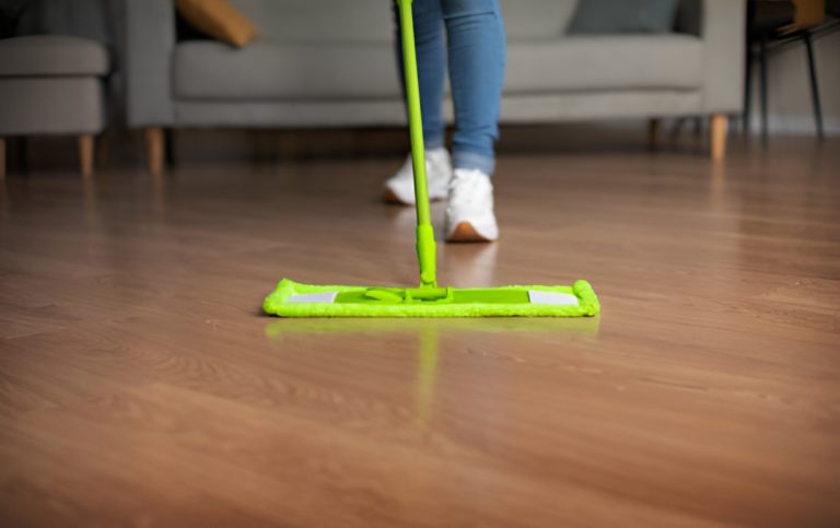 woman mopping vinyl flooring